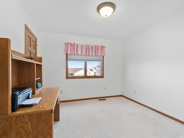 office area with carpet floors, visible vents, and baseboards