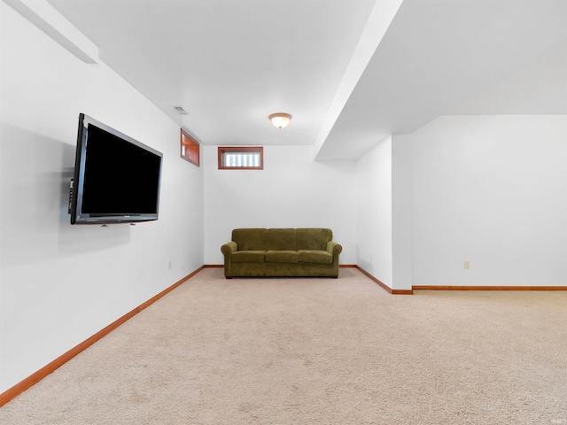 unfurnished room with carpet flooring, visible vents, and baseboards