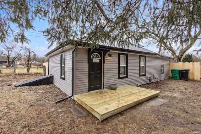 view of outbuilding with fence