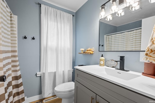 bathroom featuring visible vents, vanity, and toilet