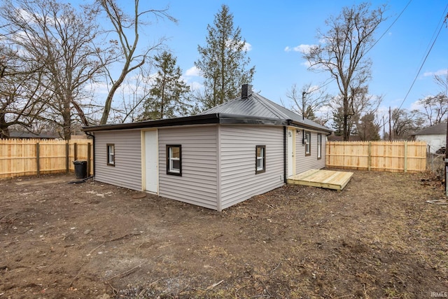 back of property with fence