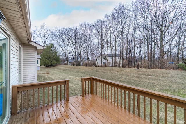 wooden terrace with a lawn