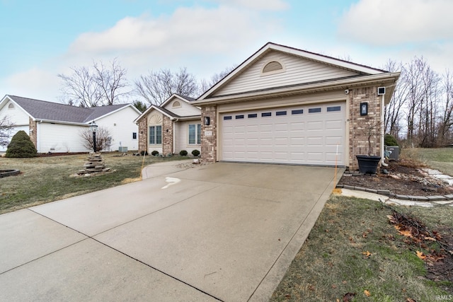 single story home with driveway, an attached garage, and brick siding