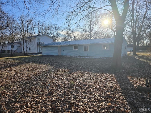 exterior space with metal roof