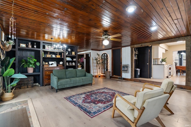 living area with ceiling fan with notable chandelier, wooden ceiling, and light wood-style floors