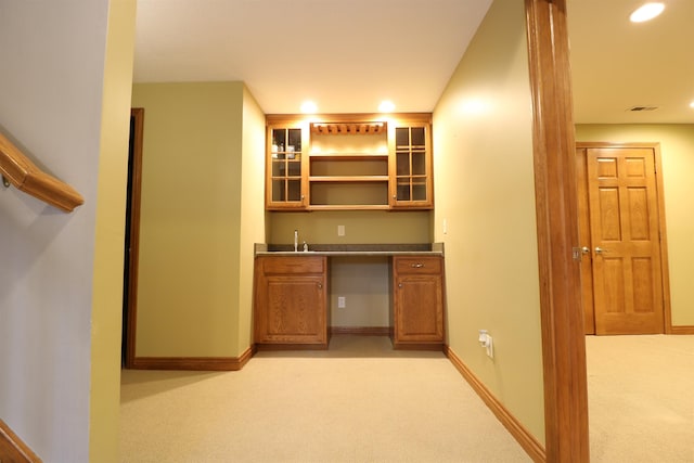 bar with recessed lighting, light colored carpet, a sink, baseboards, and wet bar