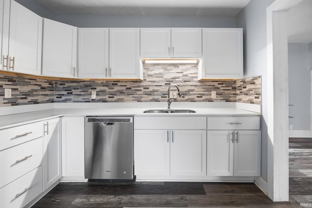 kitchen with dishwasher, light countertops, a sink, and white cabinets