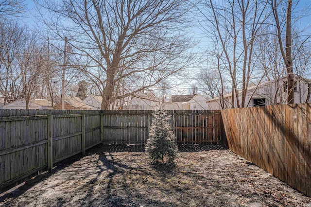 view of yard featuring a fenced backyard