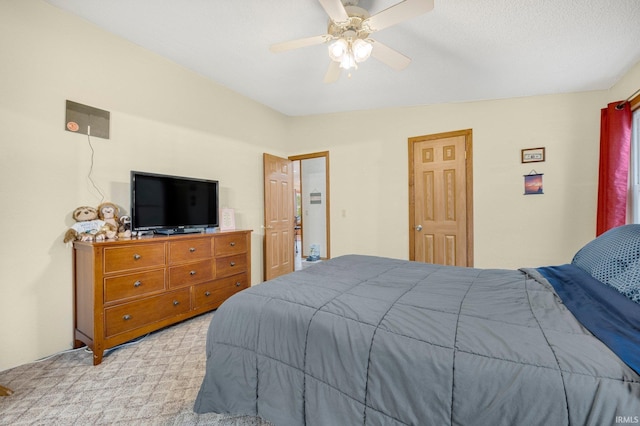 carpeted bedroom featuring a ceiling fan