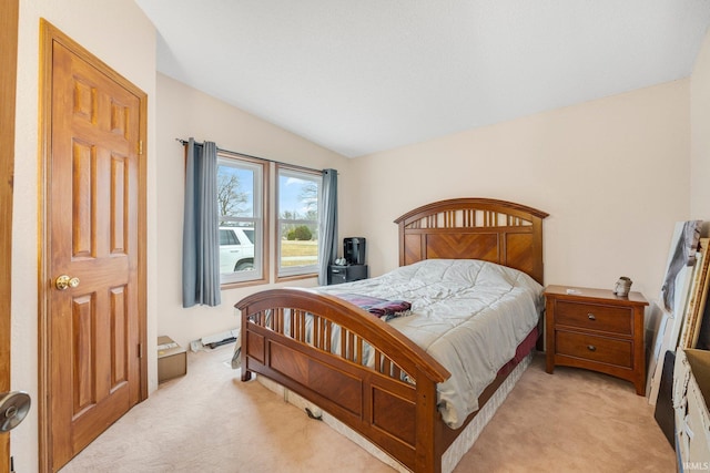 bedroom featuring light carpet and lofted ceiling