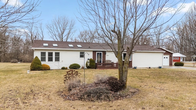 ranch-style home with an attached garage, a front lawn, and concrete driveway