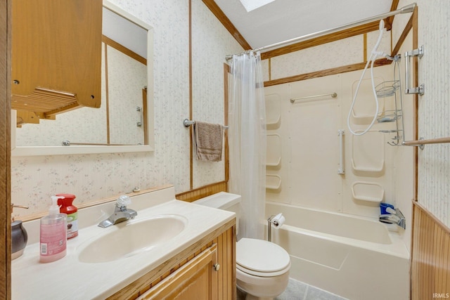 full bath featuring shower / bath combo, vanity, toilet, and wallpapered walls