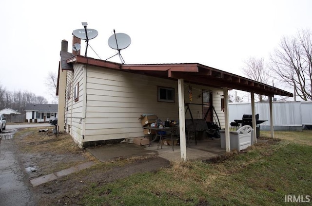 back of house featuring fence and a patio