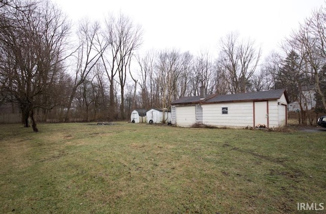 view of yard with a shed and an outdoor structure