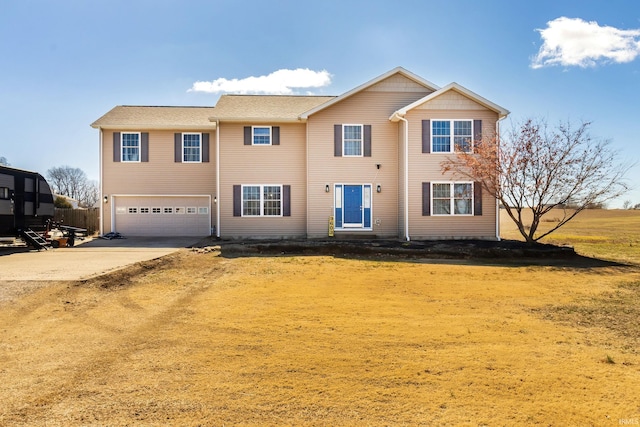 view of front of property with driveway and a garage