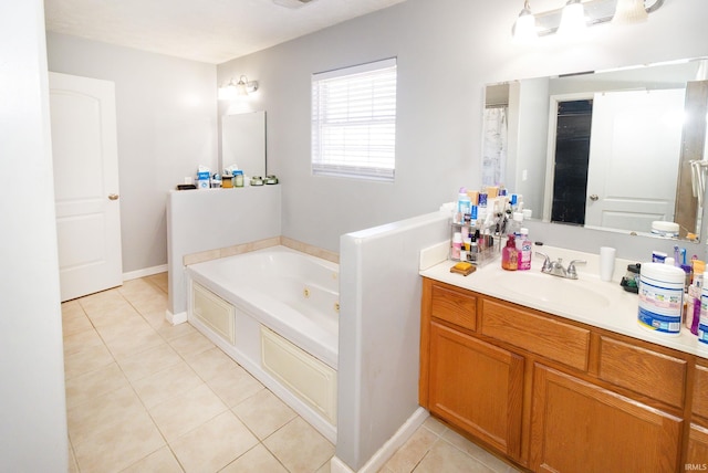 full bathroom with a whirlpool tub, tile patterned flooring, vanity, and baseboards