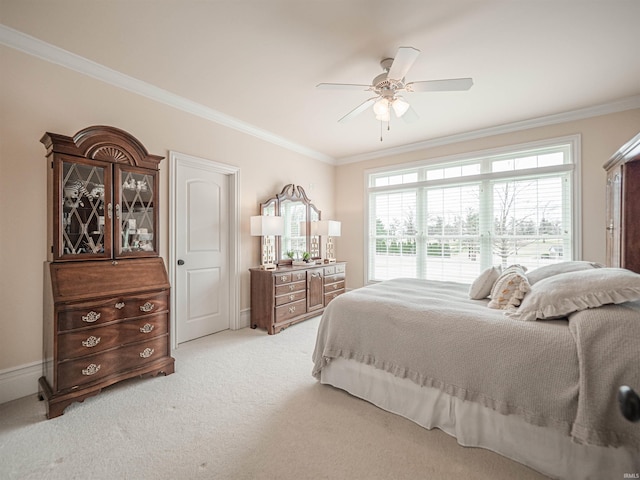 bedroom featuring light colored carpet, crown molding, and ceiling fan