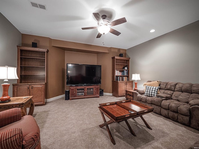 living area with recessed lighting, light colored carpet, visible vents, a ceiling fan, and baseboards