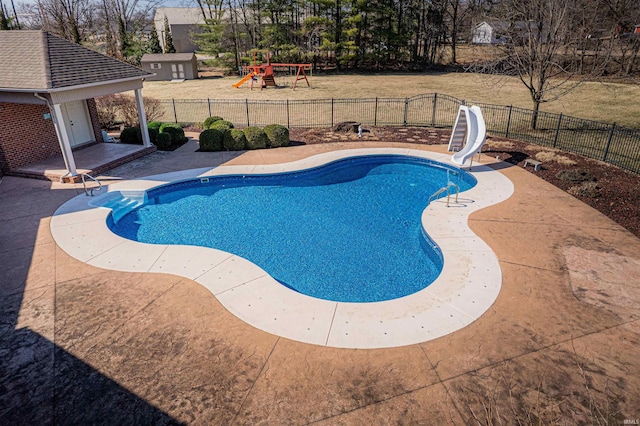 view of pool with a fenced in pool, a playground, a patio area, a water slide, and a fenced backyard