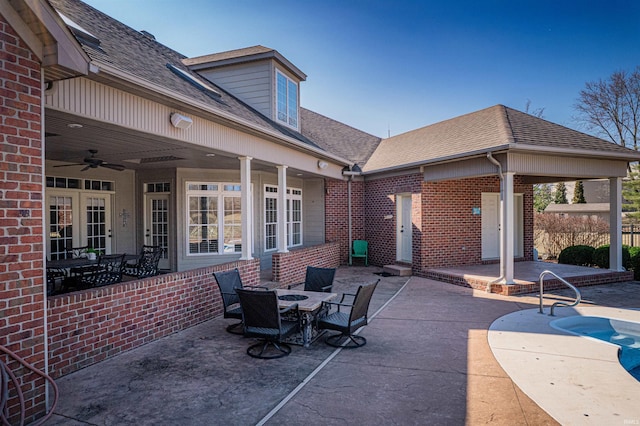 view of patio featuring ceiling fan, an outdoor pool, and outdoor dining space