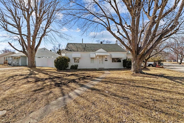 ranch-style house with fence