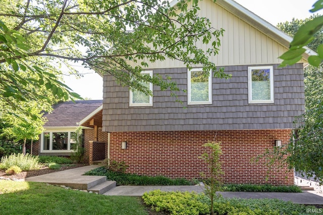 view of property exterior featuring brick siding