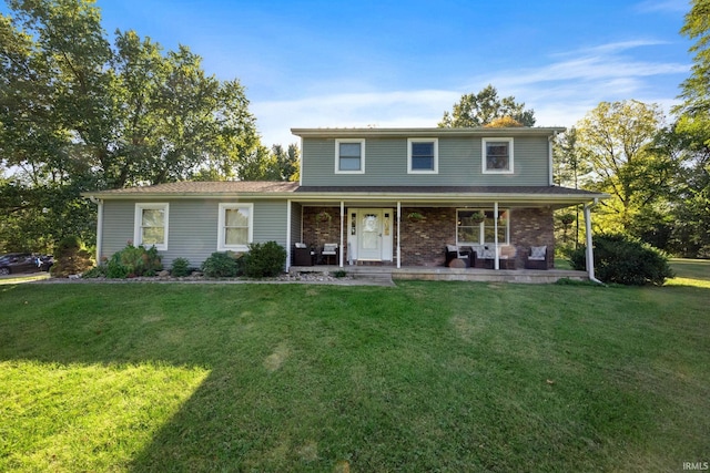 traditional-style house with a front lawn, a porch, and brick siding