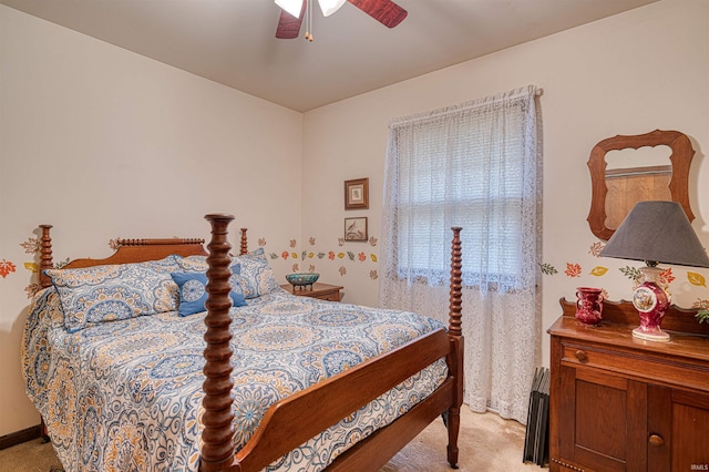 bedroom featuring light carpet and ceiling fan