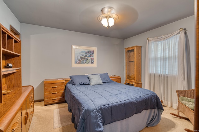 bedroom featuring light colored carpet