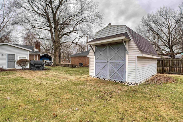 view of shed with fence