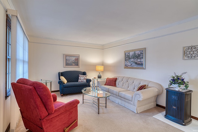 carpeted living area featuring baseboards and crown molding