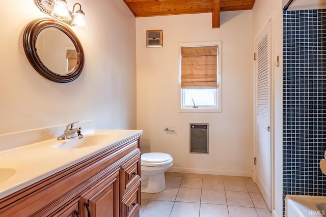 bathroom featuring tile patterned flooring, toilet, a sink, wood ceiling, and a closet