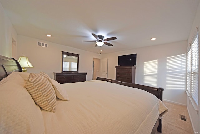 bedroom with light carpet, recessed lighting, visible vents, and a ceiling fan