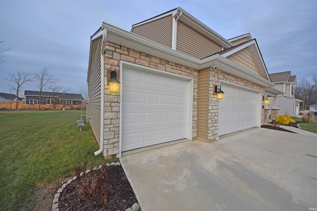 garage featuring concrete driveway