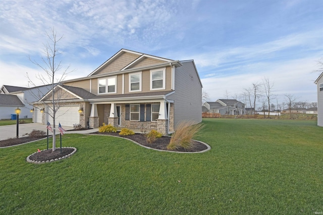 craftsman-style house featuring a front lawn, driveway, an attached garage, and a porch