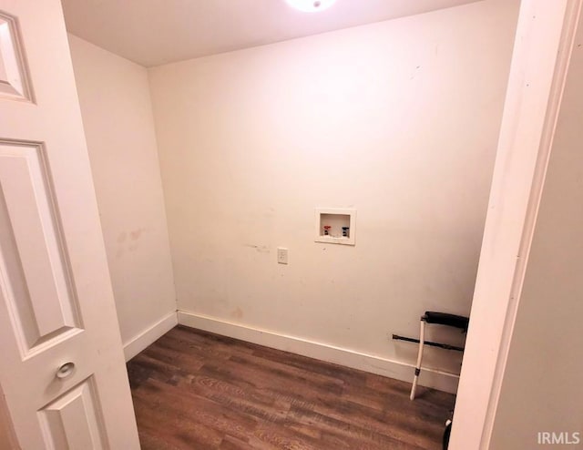 washroom featuring dark wood-type flooring, washer hookup, and baseboards