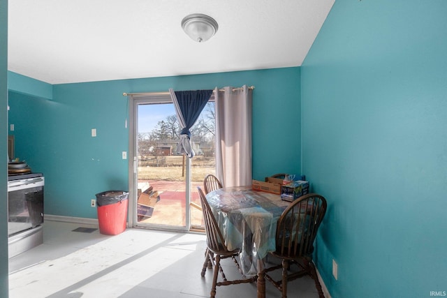 dining space featuring baseboards