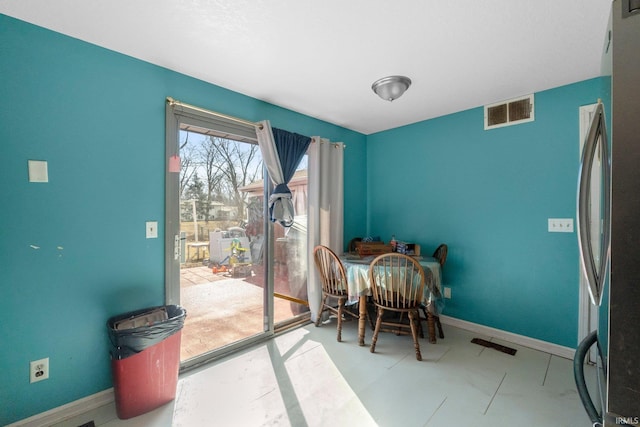 dining room featuring baseboards and visible vents