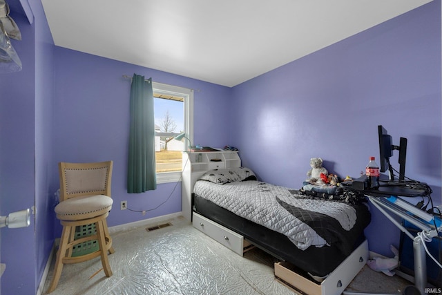 bedroom with visible vents and baseboards