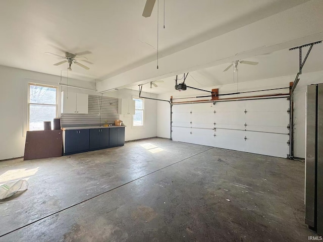 garage with a garage door opener and ceiling fan