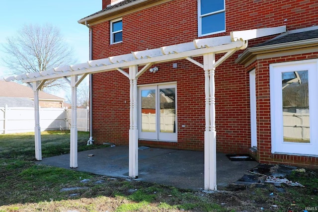 view of patio featuring fence