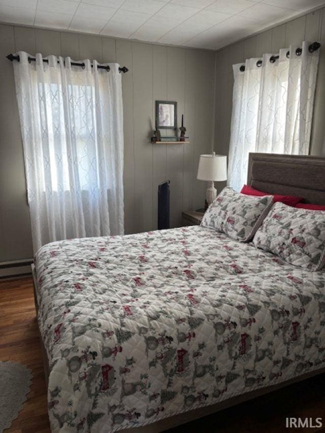 bedroom featuring wood finished floors