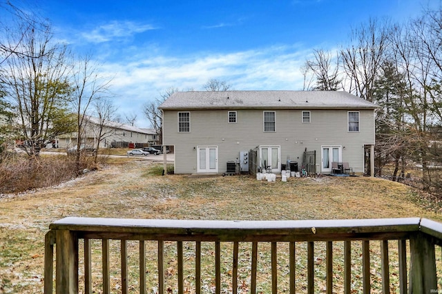 rear view of house featuring central AC unit