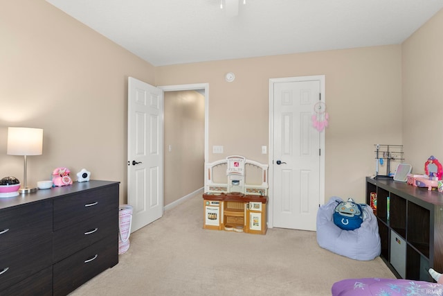 bedroom featuring light carpet