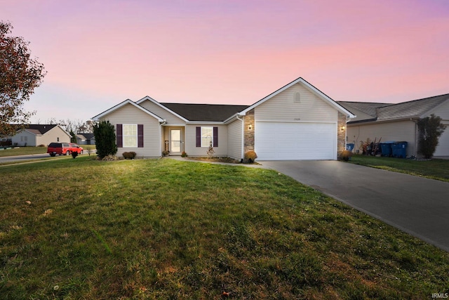 ranch-style home with an attached garage, a front lawn, and concrete driveway