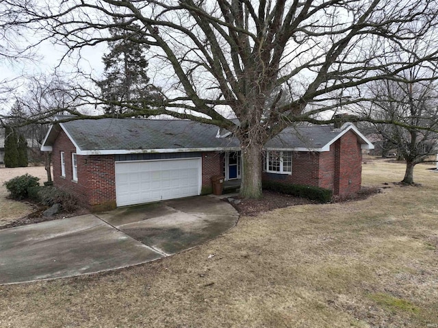 ranch-style home featuring driveway, brick siding, a front lawn, and an attached garage