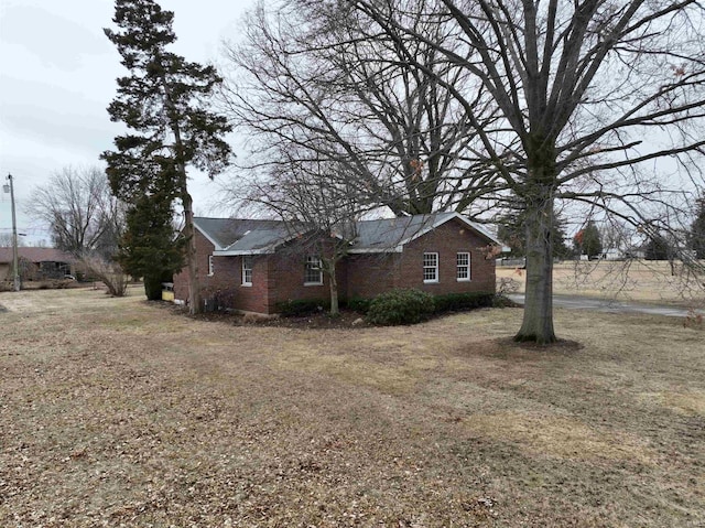 view of home's exterior with brick siding