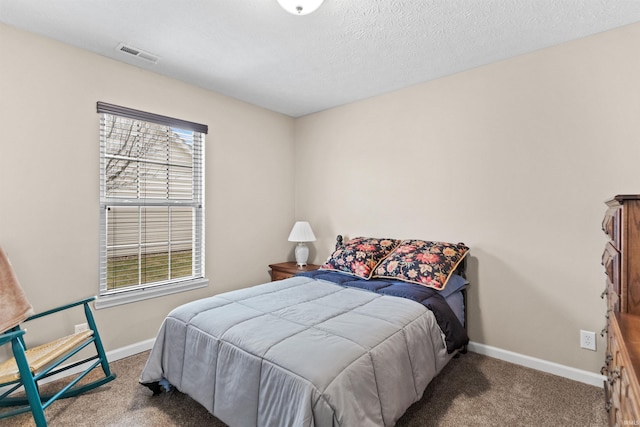 bedroom with carpet floors, visible vents, baseboards, and multiple windows