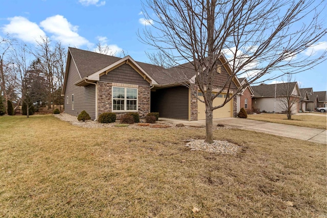 view of front of property with an attached garage, driveway, stone siding, and a front yard