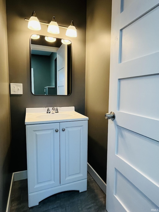 bathroom featuring vanity and baseboards